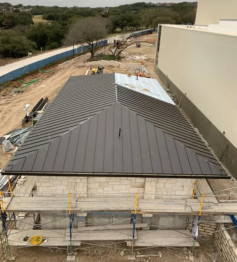 Metal roof new construction with scaffolding in Spring Ridge